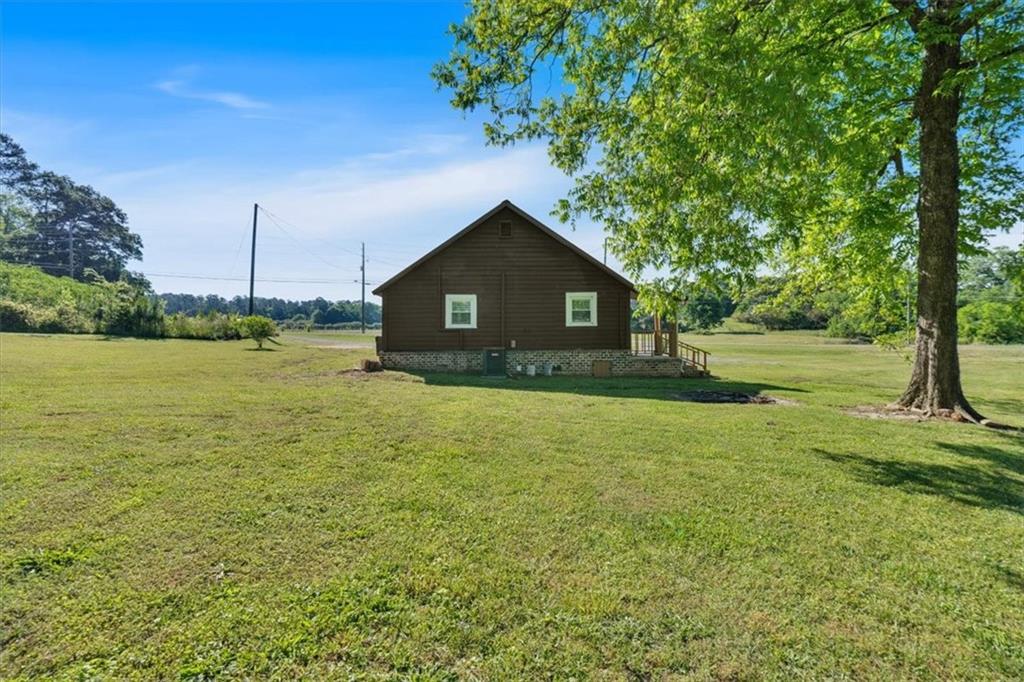 3049 Highway 411 White, GA 30184 - Photo 33 of 49 a front view of a house with a yard