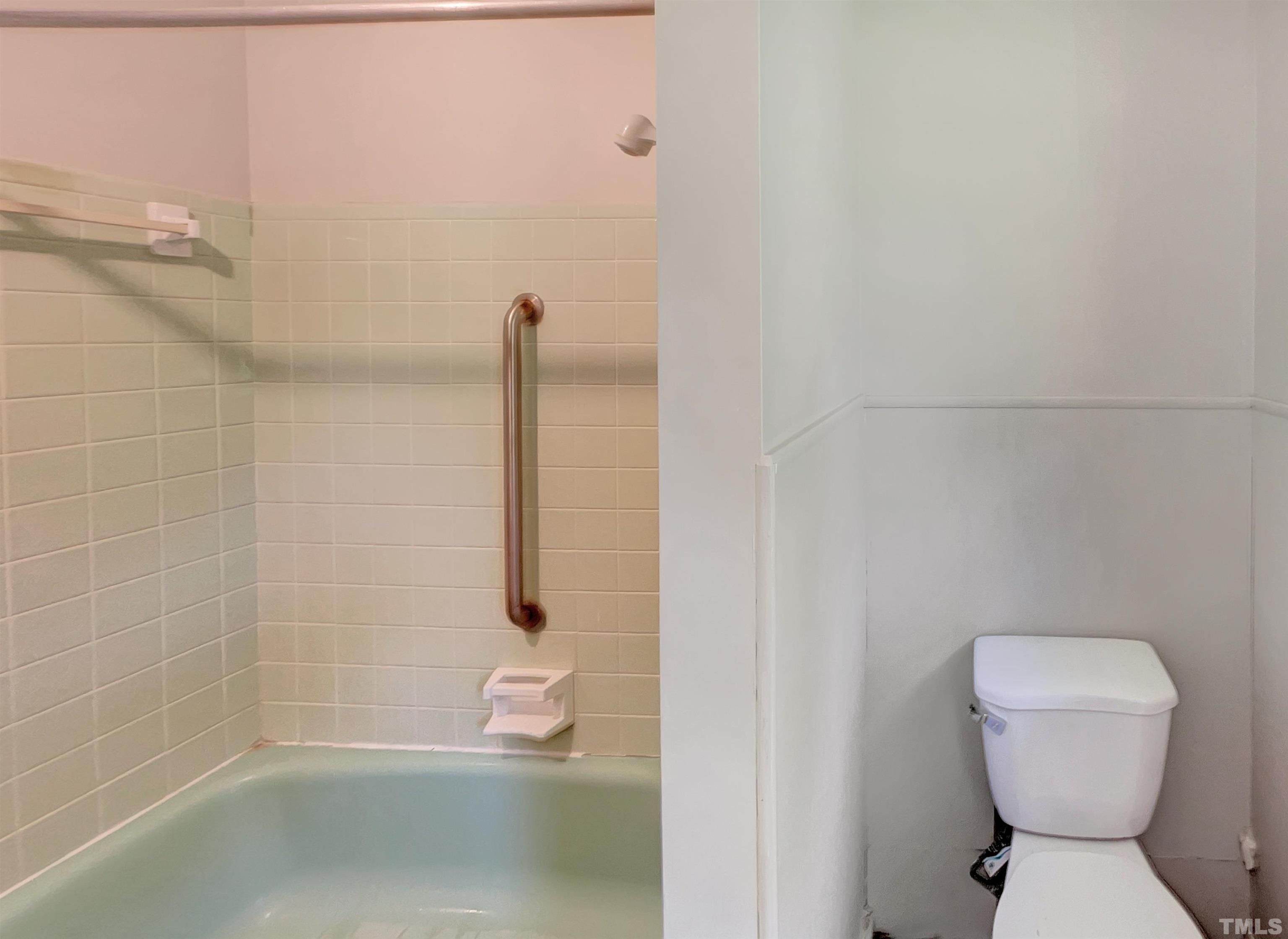 2011 Waters Drive Raleigh, NC 27610 - Photo 15 of 18 a bathroom with a toilet and shower