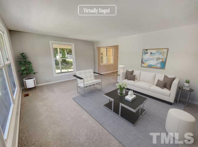 2011 Waters Drive Raleigh, NC 27610 - Photo 2 of 18 a living room with furniture and a large window