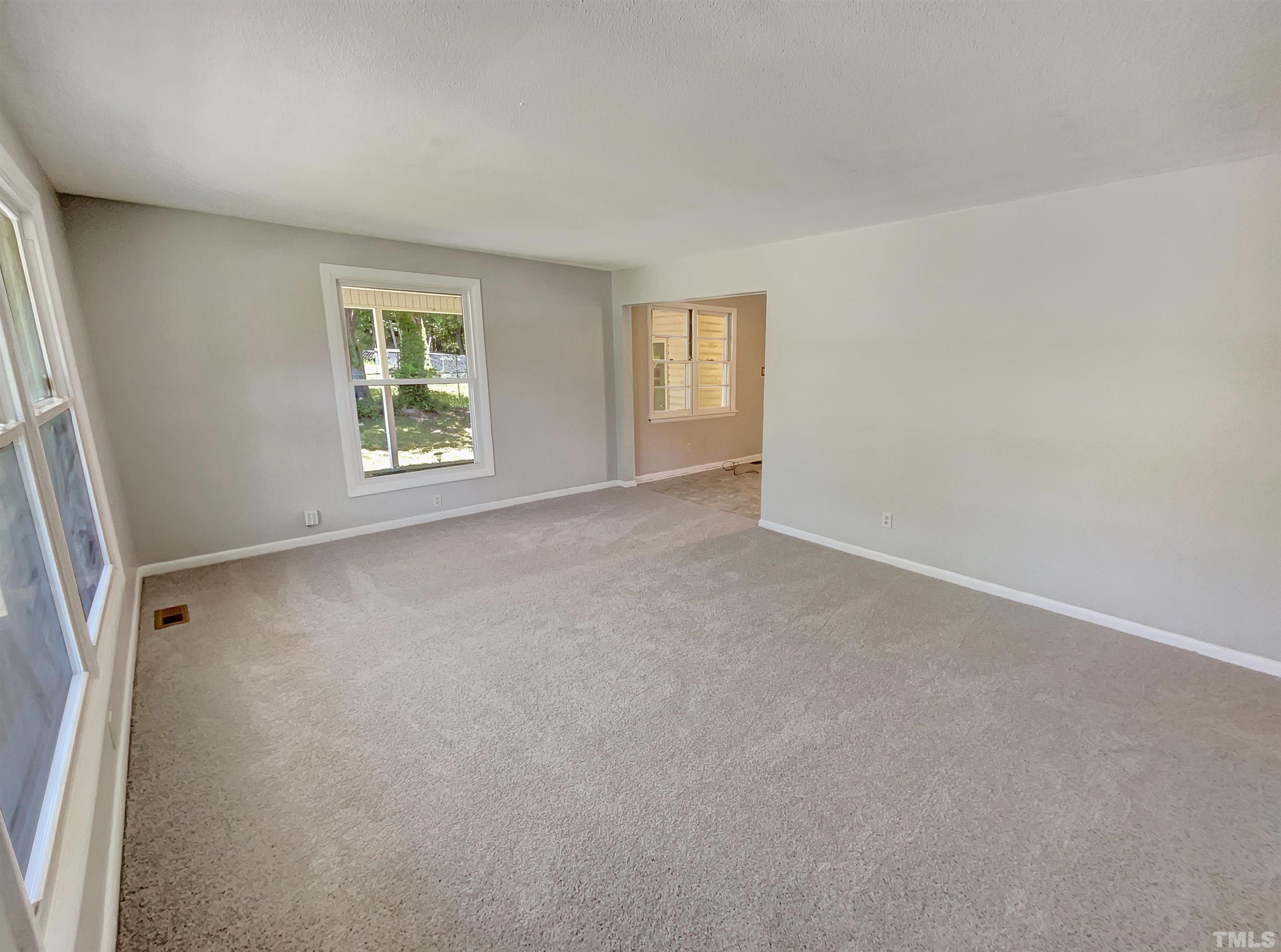 2011 Waters Drive Raleigh, NC 27610 - Photo 3 of 18 an empty room with windows