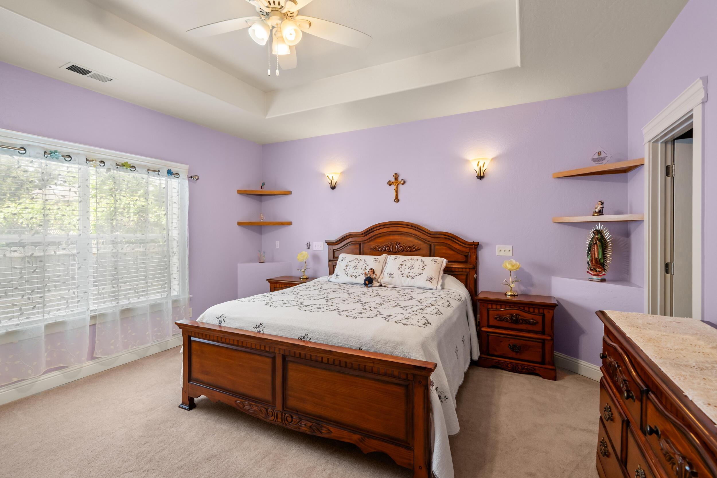 1227 Lithia Way Talent, OR 97540 - Photo 15 of 37 a bedroom with a bed and a chandelier
