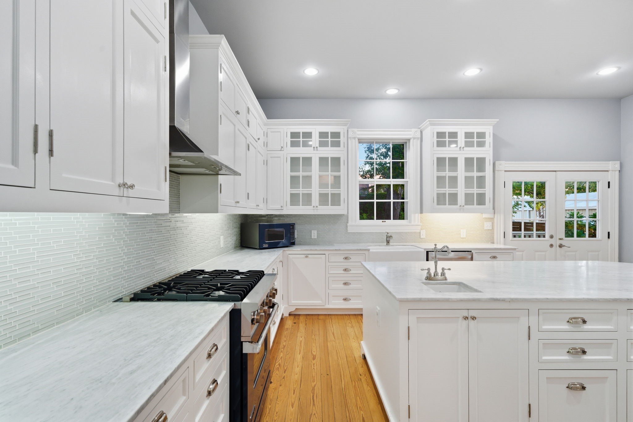 1818 Decatur Street Houston, TX 77007 - Photo 16 of 48 a kitchen with a sink stove and cabinets