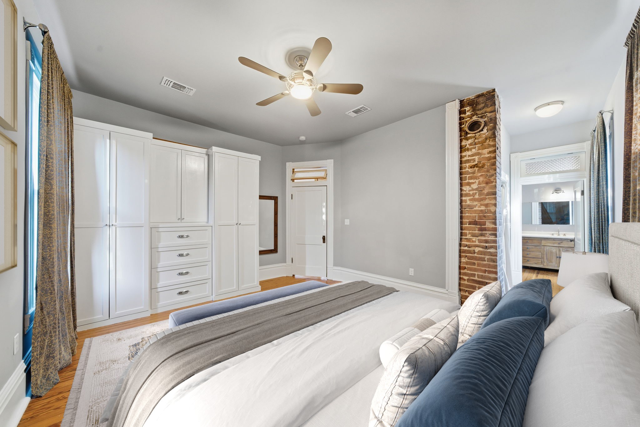 1818 Decatur Street Houston, TX 77007 - Photo 25 of 48 a spacious bedroom with a large bed and a chandelier