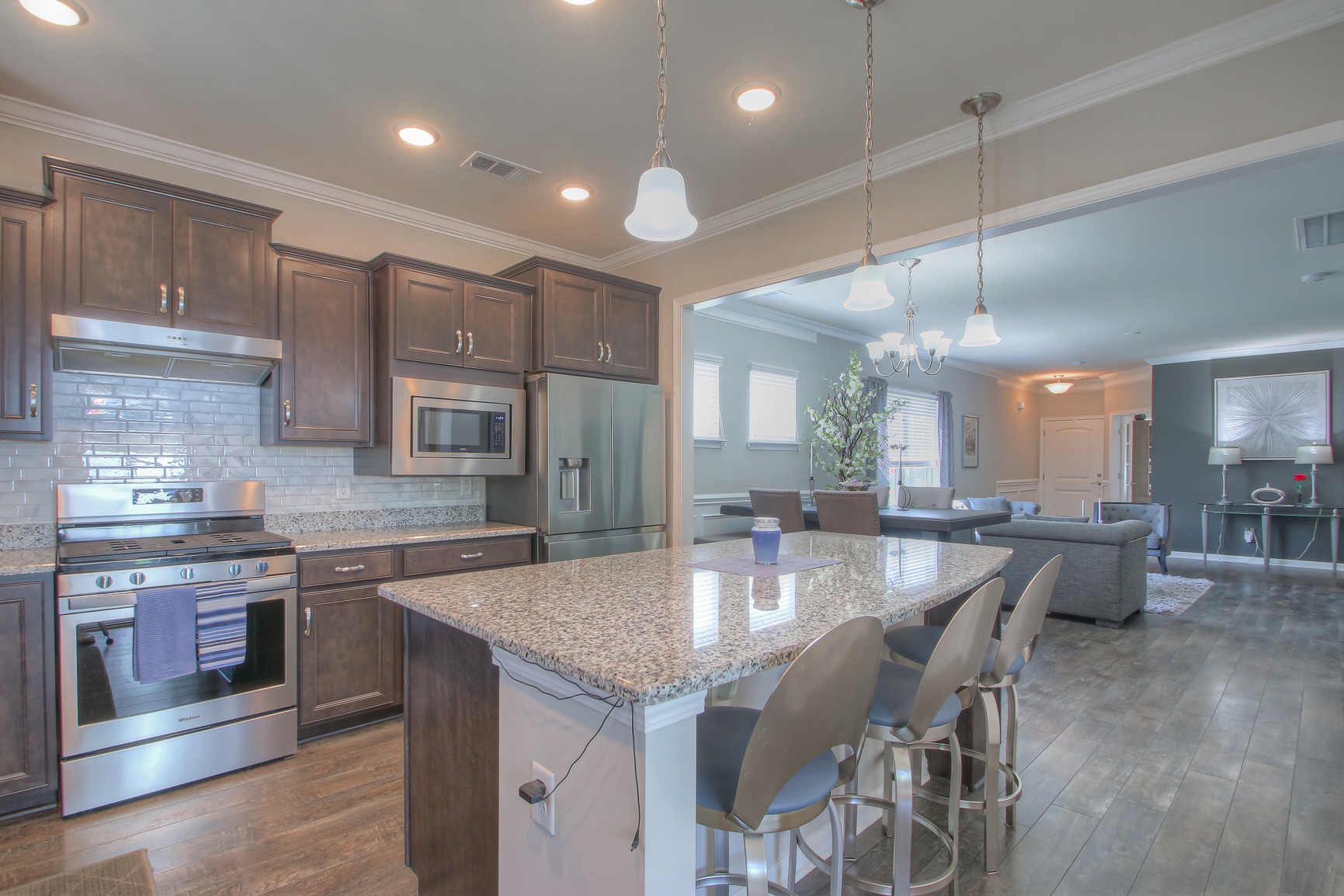 104 Tipton Pass Spring Hill, TN 37174 - Photo 13 of 40 a kitchen with granite countertop lots of counter top space and stainless steel appliances