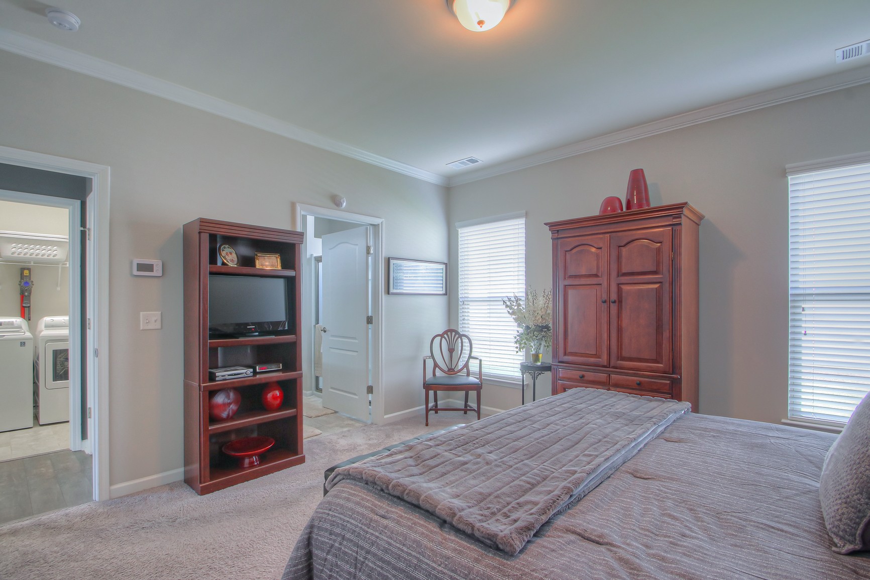 104 Tipton Pass Spring Hill, TN 37174 - Photo 20 of 40 a bedroom with a bed and a dresser in it
