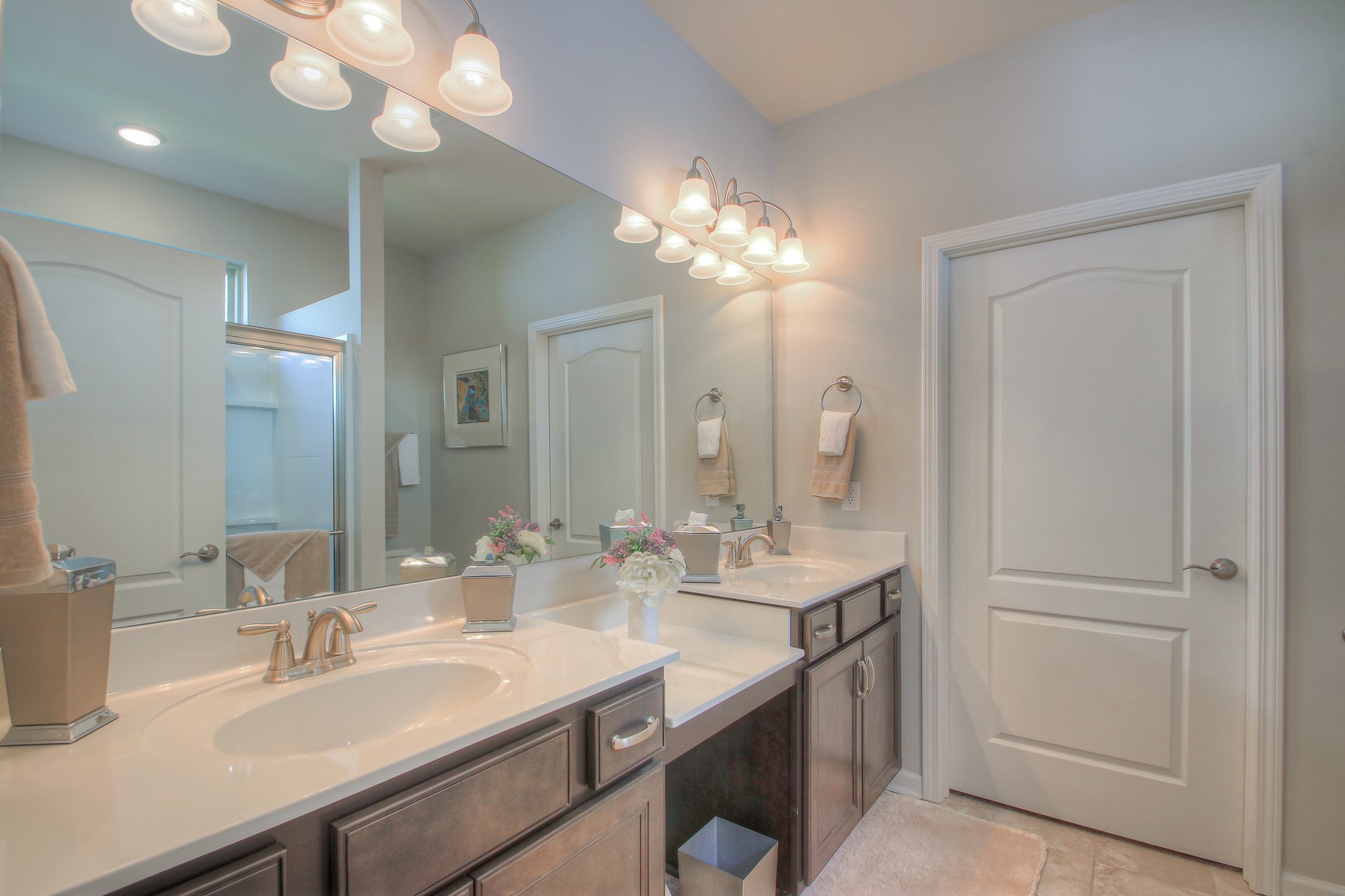 104 Tipton Pass Spring Hill, TN 37174 - Photo 21 of 40 a bathroom with a sink a light fixture and a mirror