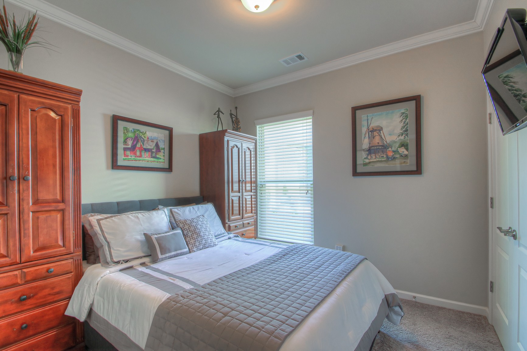 104 Tipton Pass Spring Hill, TN 37174 - Photo 23 of 40 a bedroom with a large bed and a window