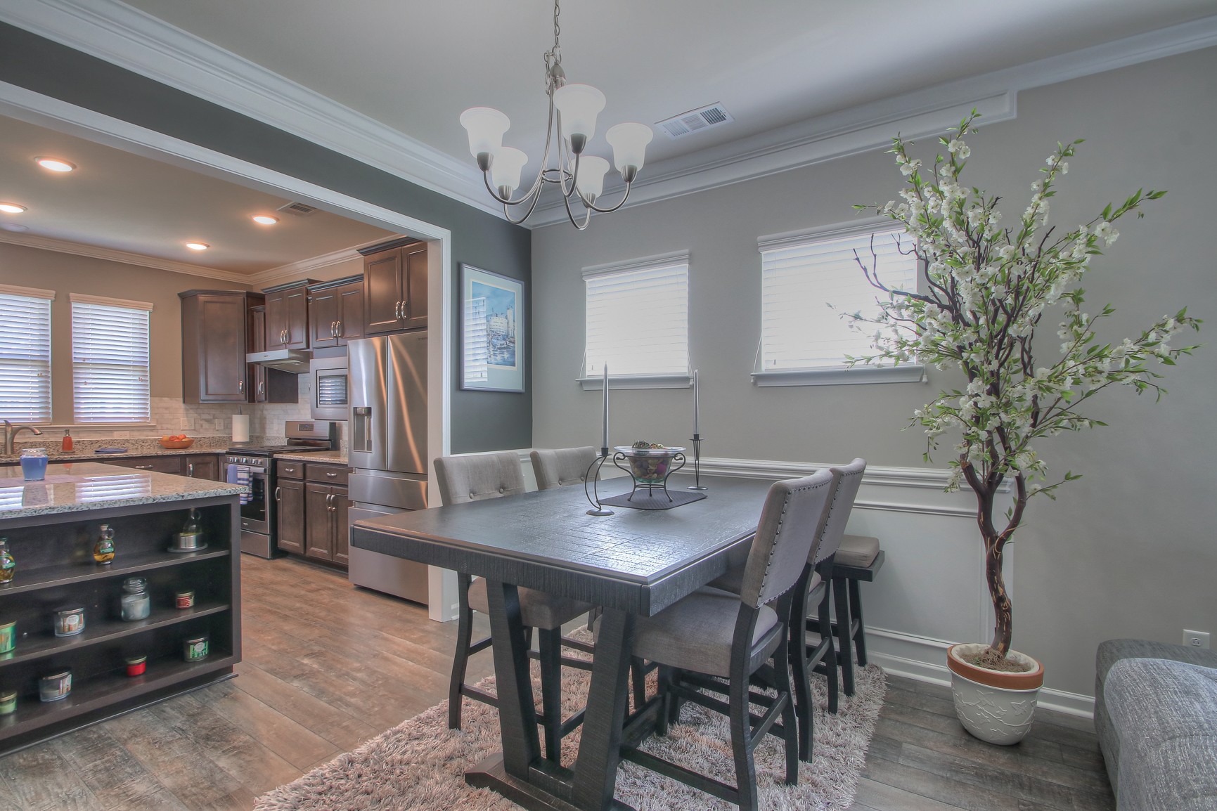 104 Tipton Pass Spring Hill, TN 37174 - Photo 9 of 40 a view of a dining room with furniture and a chandelier
