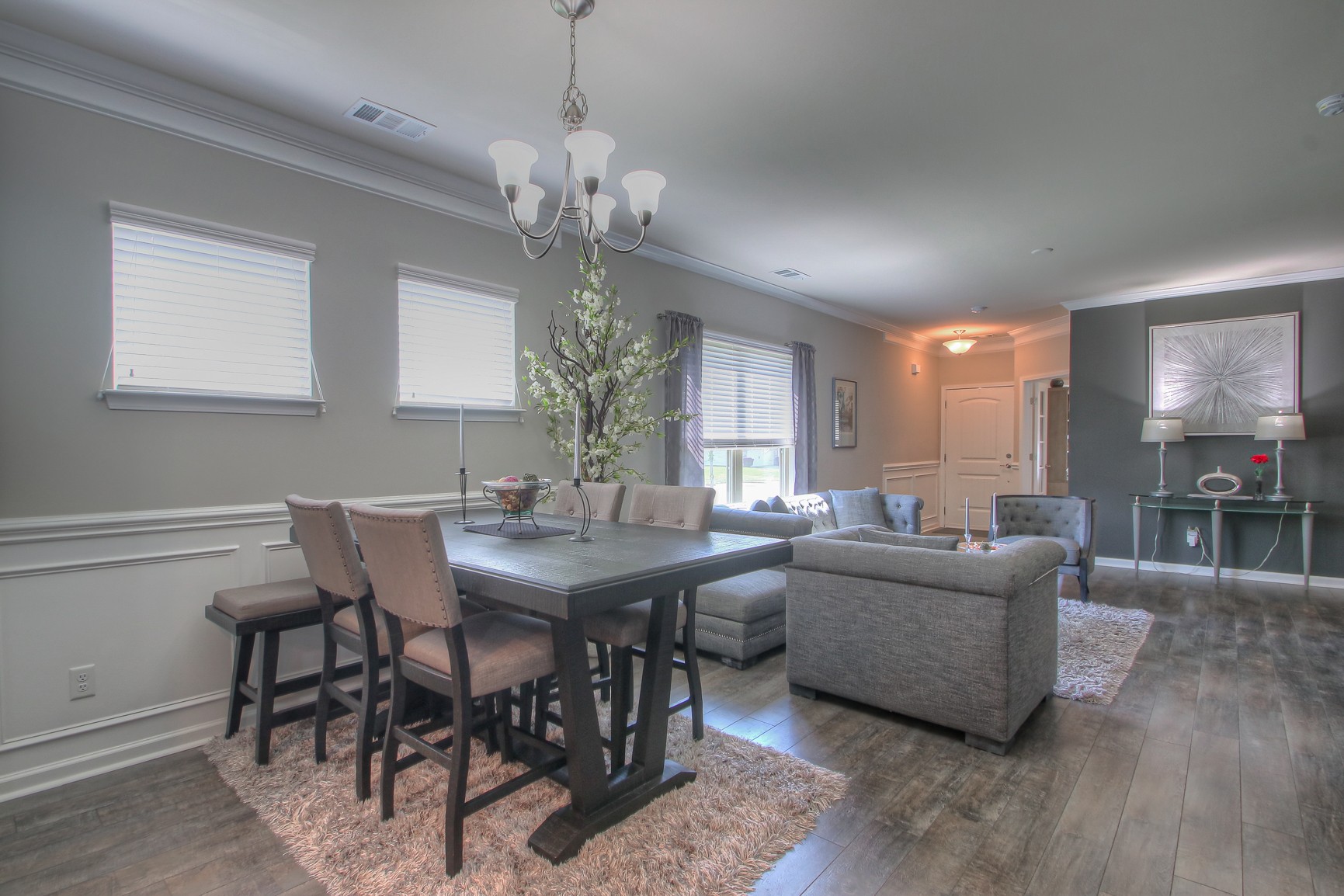 104 Tipton Pass Spring Hill, TN 37174 - Photo 10 of 40 a view of a dining room with furniture a chandelier and wooden floor