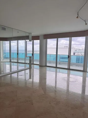 a view of an empty room with a large window