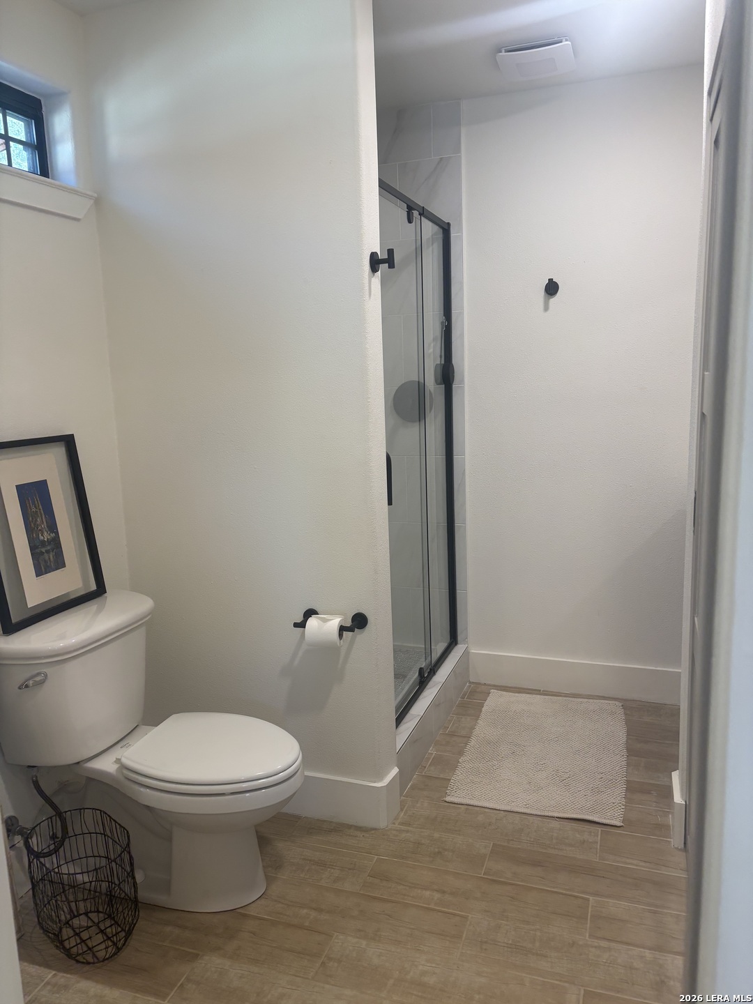 18014 Scenic Loop Road, Unit A Helotes, TX 78023 - Photo 11 of 22 a bathroom with a toilet and a shower