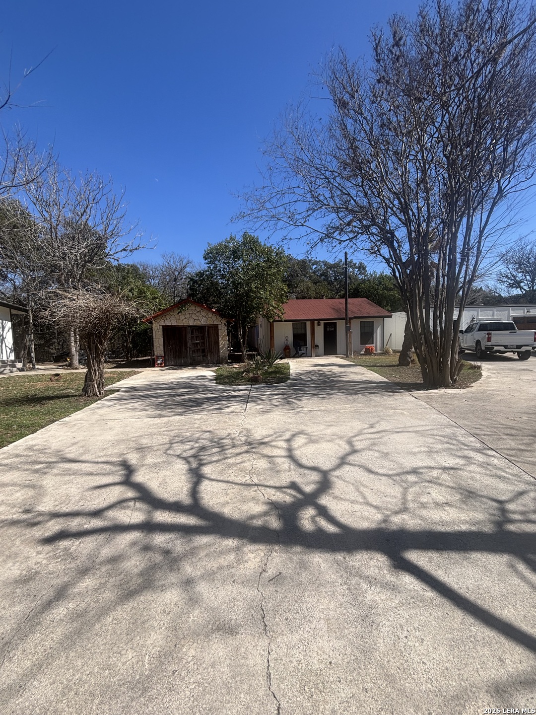 18014 Scenic Loop Road, Unit A Helotes, TX 78023 - Photo 17 of 22 a view of house with snow on the road