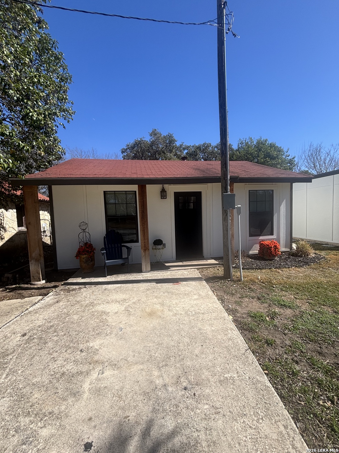 18014 Scenic Loop Road, Unit A Helotes, TX 78023 - Photo 19 of 22 a view of a house with a backyard and porch