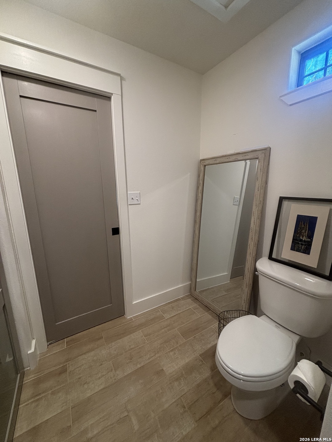 18014 Scenic Loop Road, Unit A Helotes, TX 78023 - Photo 20 of 22 a white toilet sitting next to a shower