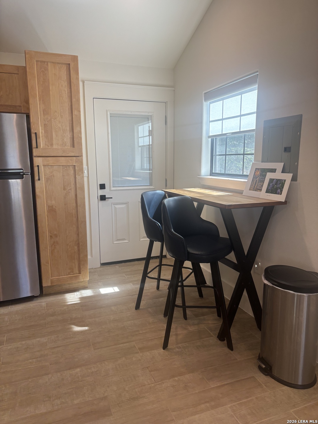 18014 Scenic Loop Road, Unit A Helotes, TX 78023 - Photo 6 of 22 a view of a dining room with furniture and a window