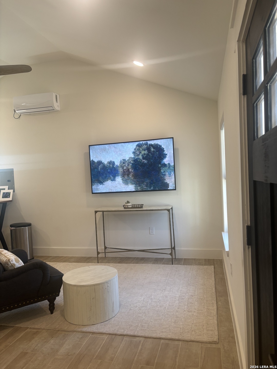 18014 Scenic Loop Road, Unit A Helotes, TX 78023 - Photo 8 of 22 a living room with couch and a painting on the wall