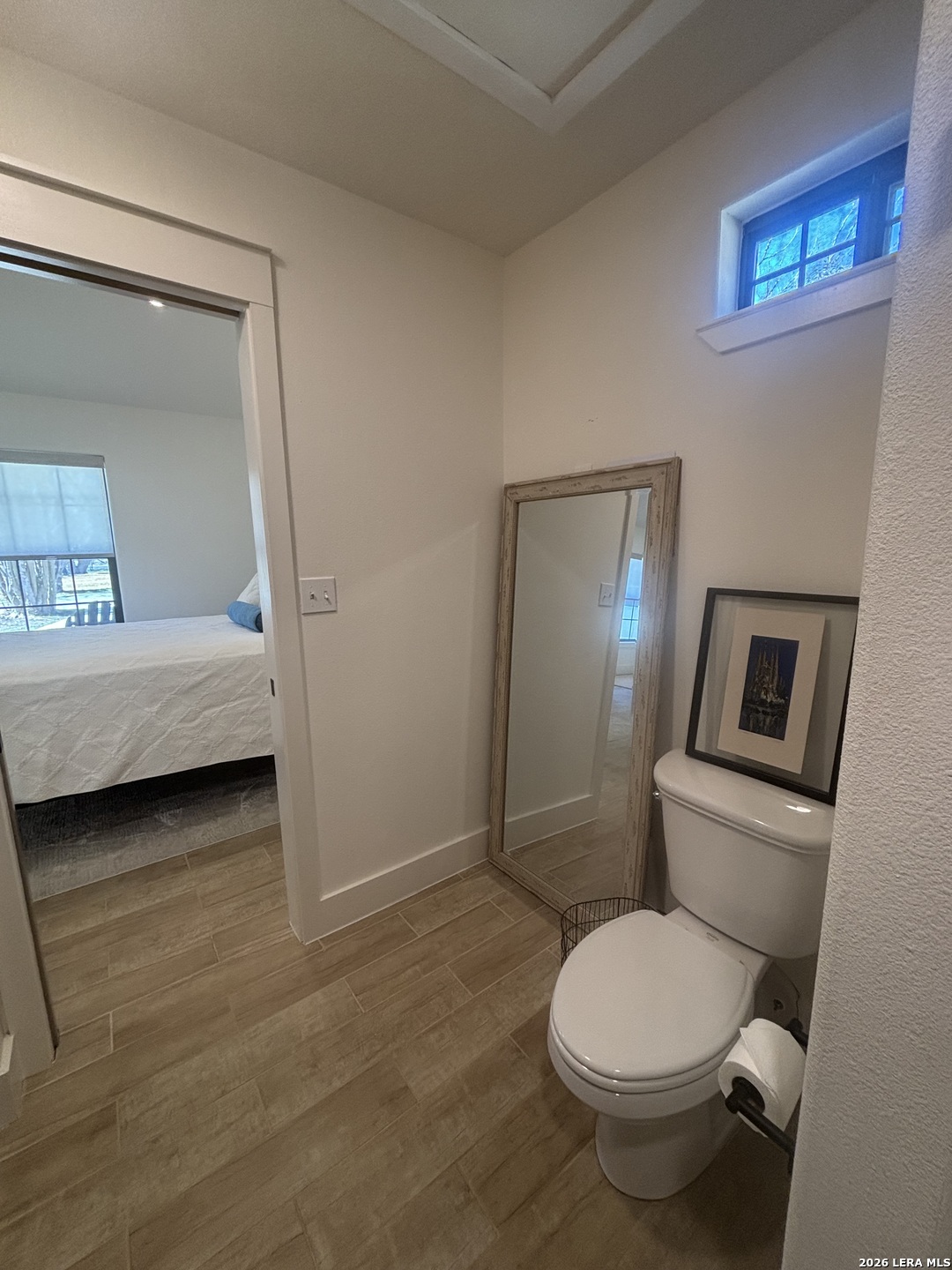 18014 Scenic Loop Road, Unit A Helotes, TX 78023 - Photo 10 of 22 a bathroom with a toilet sink and shower