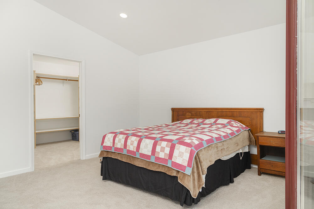679 West Valley View Road Talent, OR 97540 - Photo 33 of 77 a bedroom with a bed and a night stand