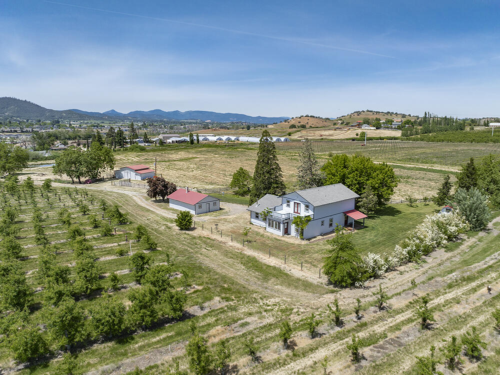 679 West Valley View Road Talent, OR 97540 - Photo 5 of 77 a view of a lake with houses in the back