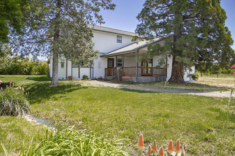 679 West Valley View Road Talent, OR 97540 - Photo 74 of 77 a house view with swimming pool in front of it
