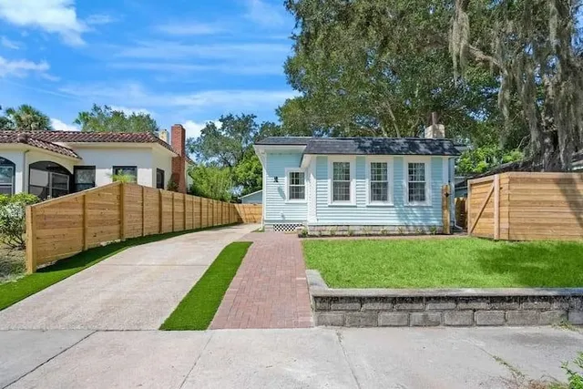 front view of a house with a yard