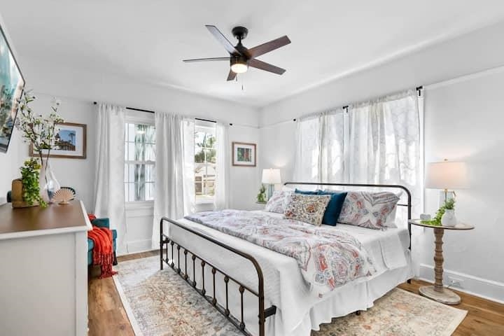 111 Colon Avenue St. Augustine, FL 32084 - Photo 25 of 46 a bedroom with a bed and a chandelier