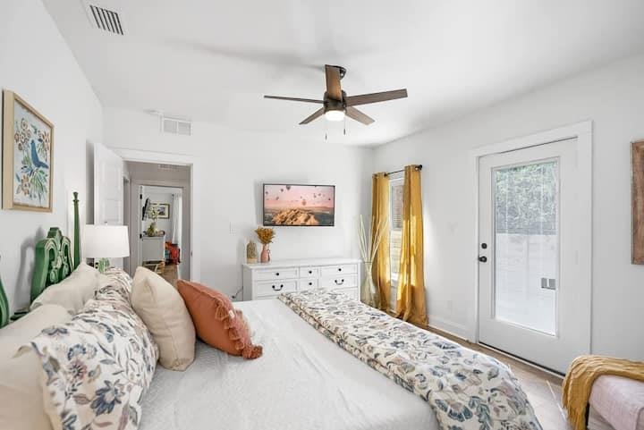 111 Colon Avenue St. Augustine, FL 32084 - Photo 31 of 46 a bedroom with a large bed and ceiling fan