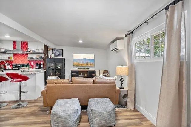 a bedroom with bed and a flat screen tv