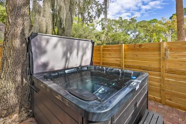 a backyard of a house with table and chairs