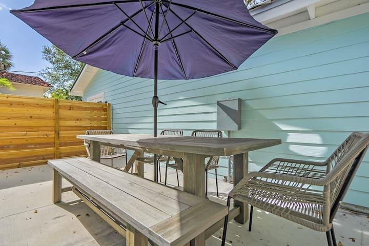 111 Colon Avenue St. Augustine, FL 32084 - Photo 9 of 46 a roof deck with a table and chairs under an umbrella