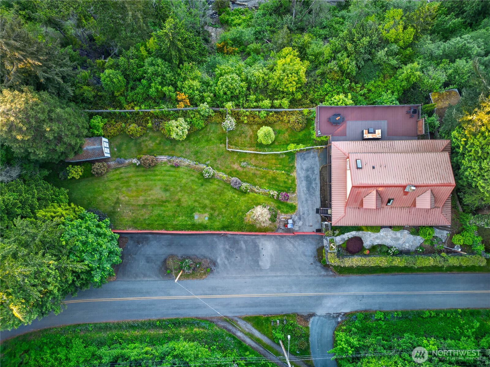4623 Guemes Island Road Anacortes, WA 98221 - Photo 31 of 40 an aerial view of a house with a garden