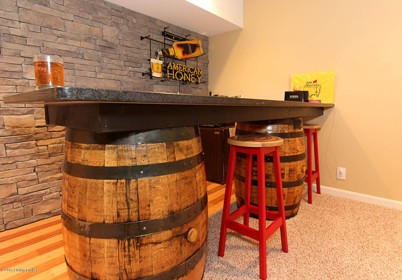 6602 Windhurst Road Louisville, KY 40207 - Photo 38 of 49 Stone accent wall, Hardwood Floor, & Custom Bourbon Barrel Bartop!