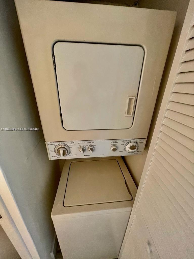 8050 Northwest 8th Street, Unit 201 Miami, FL 33126 - Photo 12 of 13 a close up view of a washer and dryer