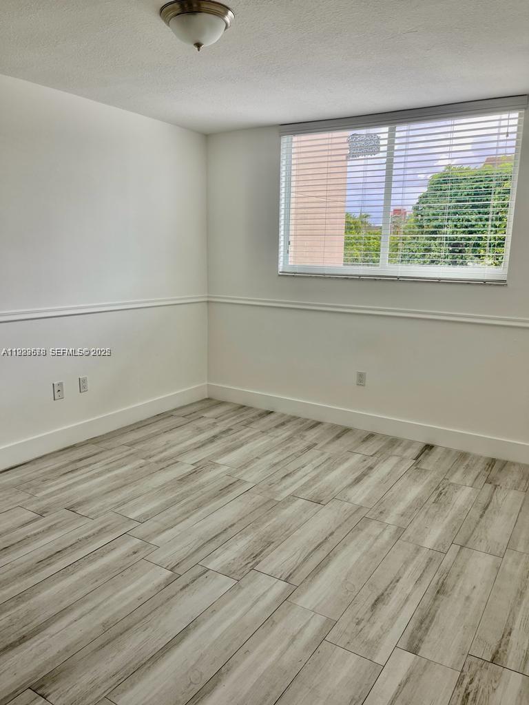 8050 Northwest 8th Street, Unit 201 Miami, FL 33126 - Photo 7 of 13 a view of a room that has a window