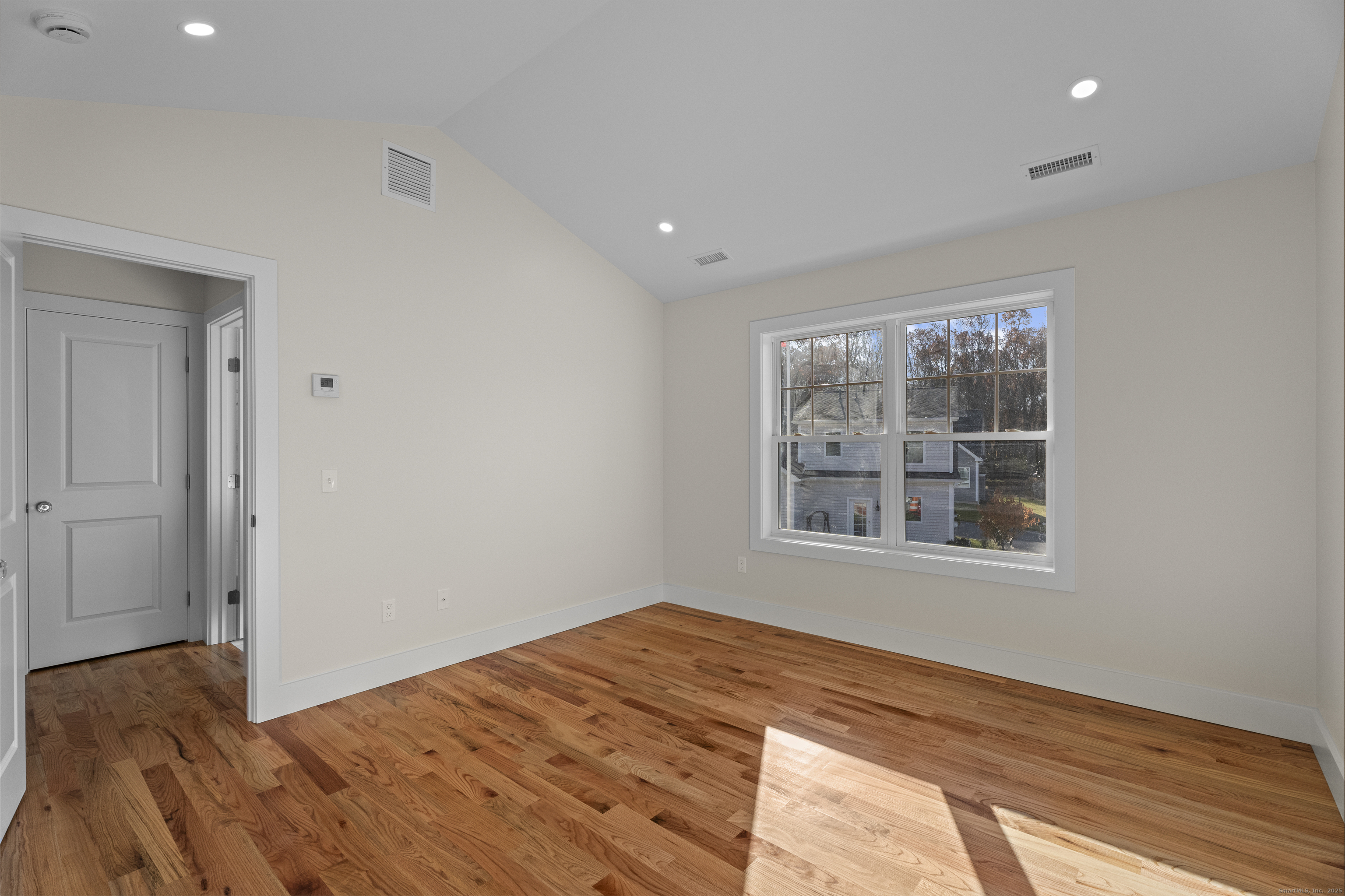 26 Ivy Hill Road, Unit 26 Waterford, CT 06385 - Photo 21 of 39 a view of empty room with wooden floor and fan