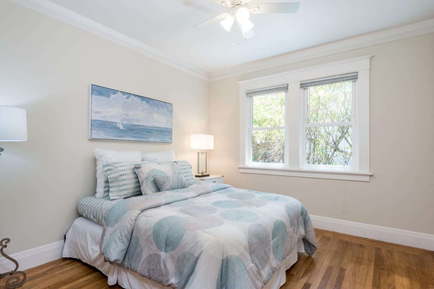 739 Prospect Row San Mateo, CA 94401 - Photo 16 of 27 a bedroom with a bed and wooden floor