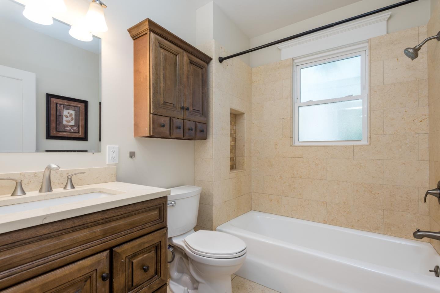 739 Prospect Row San Mateo, CA 94401 - Photo 17 of 27 a bathroom with a sink a toilet and a bathtub