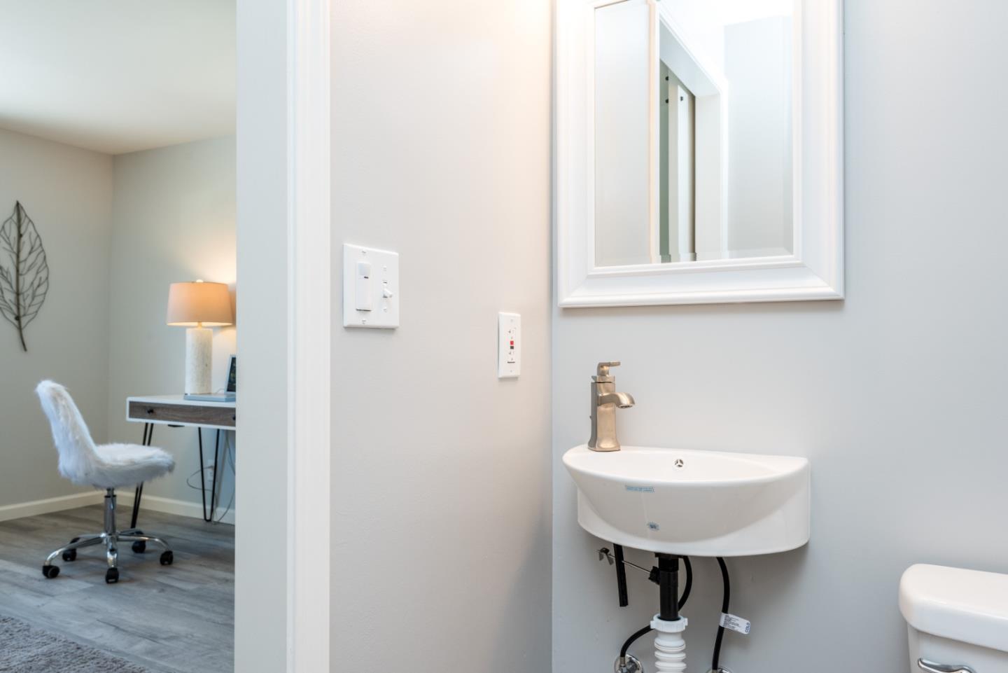739 Prospect Row San Mateo, CA 94401 - Photo 20 of 27 a bathroom with a sink and a mirror