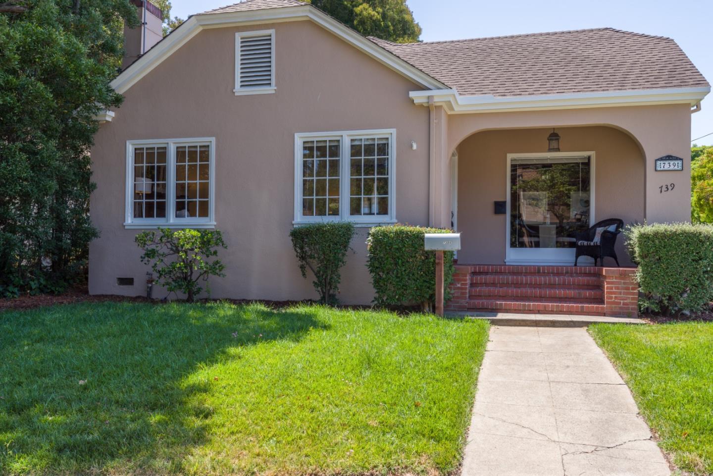 739 Prospect Row San Mateo, CA 94401 - Photo 2 of 27 a front view of a house with garden