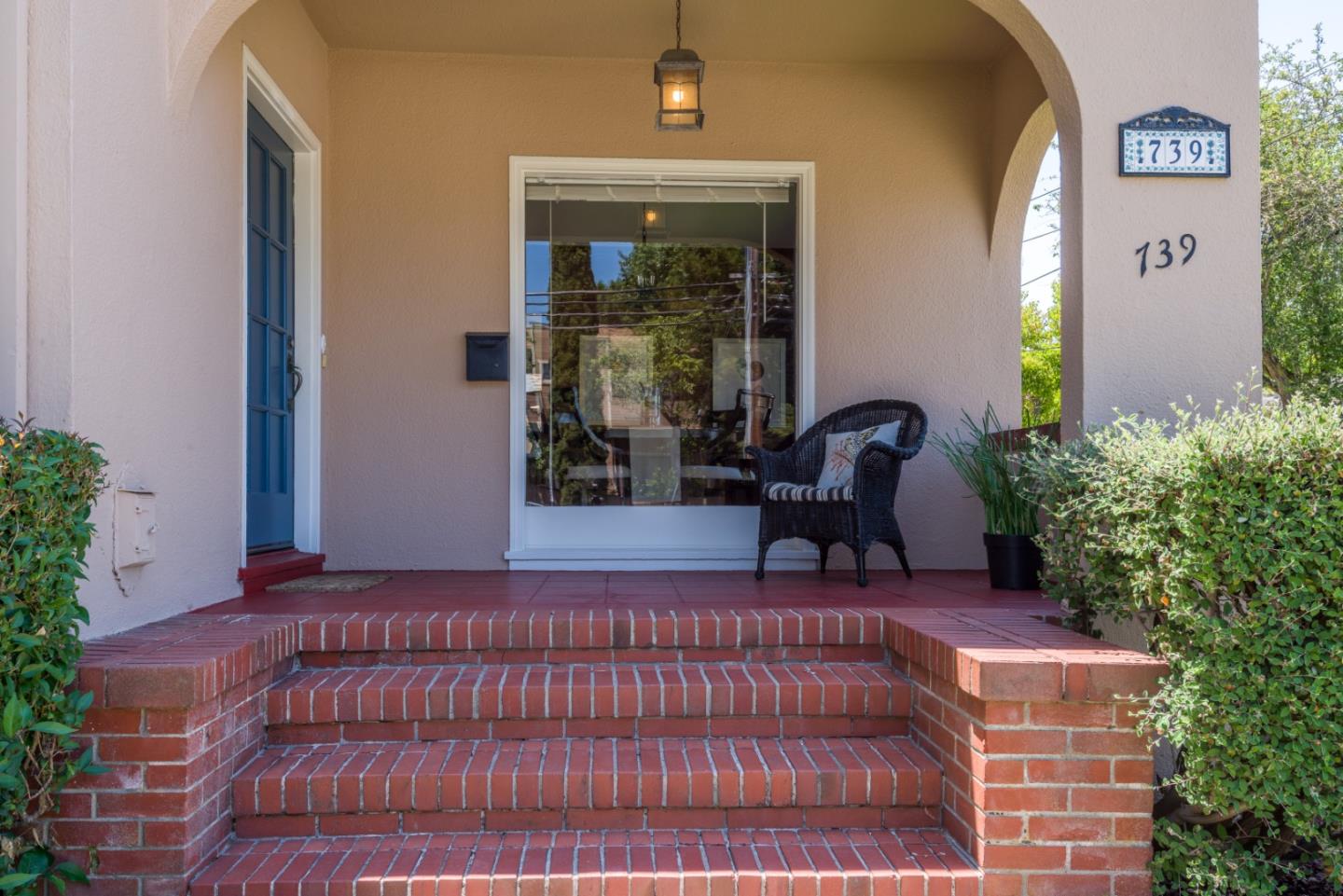 739 Prospect Row San Mateo, CA 94401 - Photo 3 of 27 a wooden bench sitting in front of a building