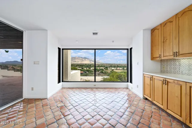 a view of a dining room with furniture window and outside view