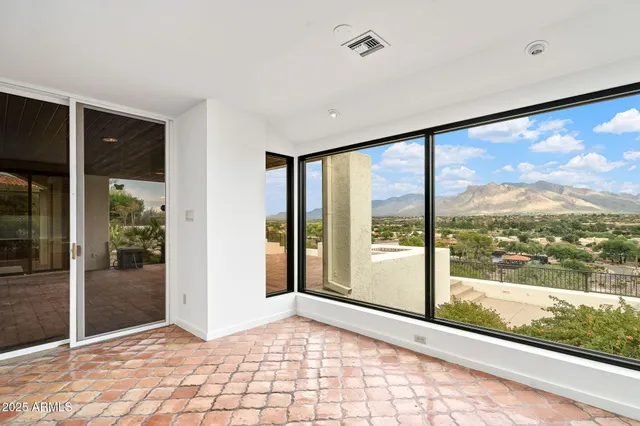a view of a room with a large window