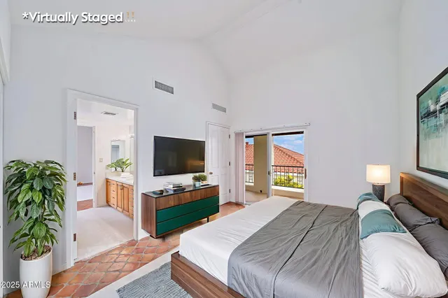 a spacious bathroom with a granite countertop sink mirror and shower