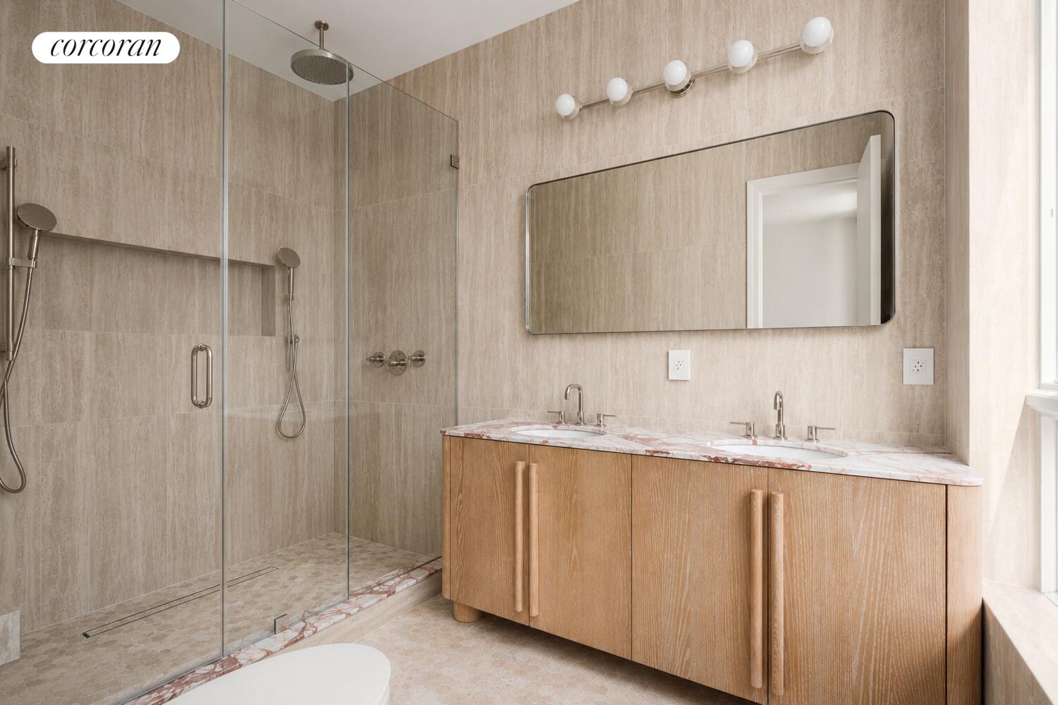 700 Monroe Street Brooklyn, NY 11221 - Photo 10 of 18 a bathroom with a granite countertop sink a mirror and shower