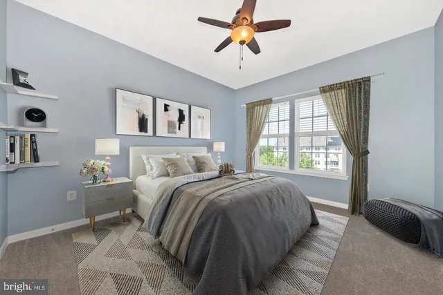 a bedroom with a bed and a couch