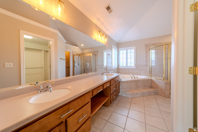 598 Hollow Creek Road Draper, UT 84020 - Photo 91 of 110 Dual vanity with integrated sinks, tiled flooring, built-in soaking tub, separate shower enclosure, and louvered window treatments