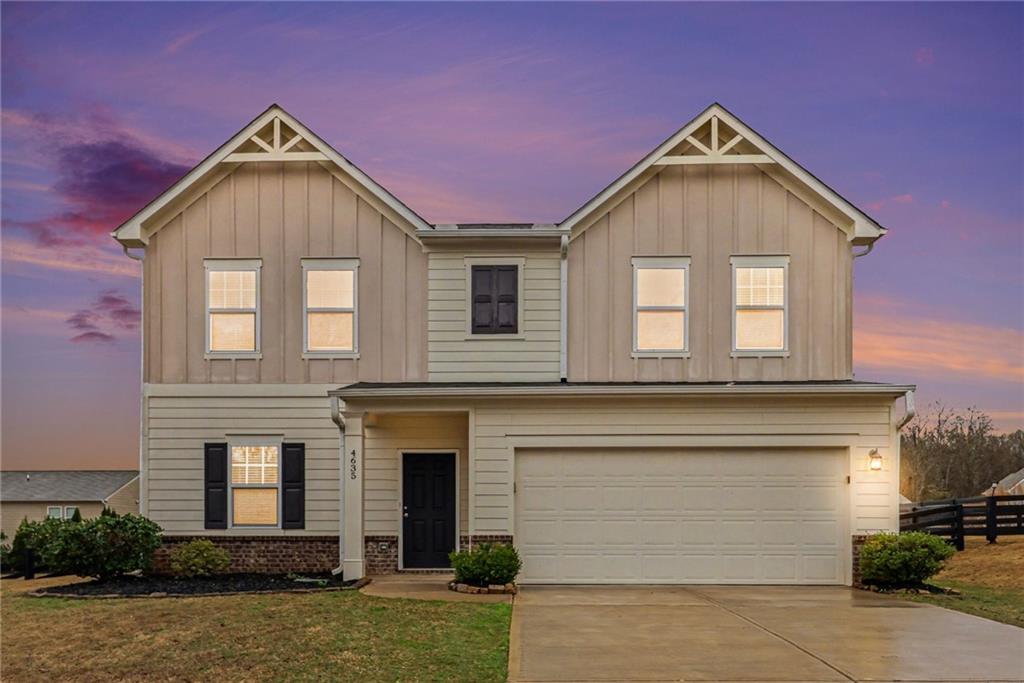 a front view of a house with garage
