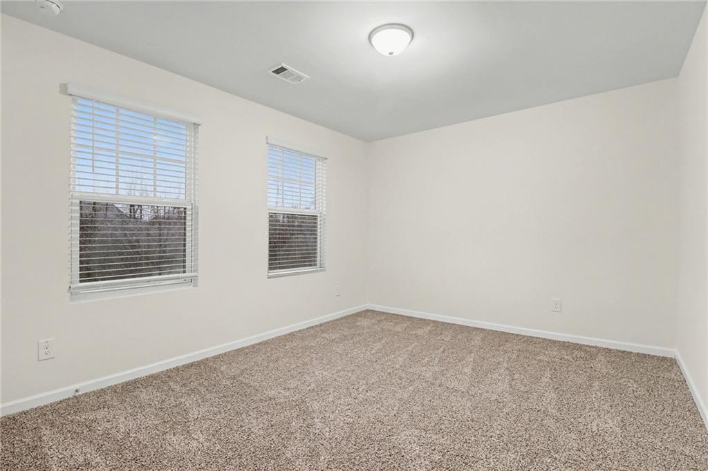 4635 Bluffton Court Cumming, GA 30028 - Photo 14 of 27 an empty room with a window