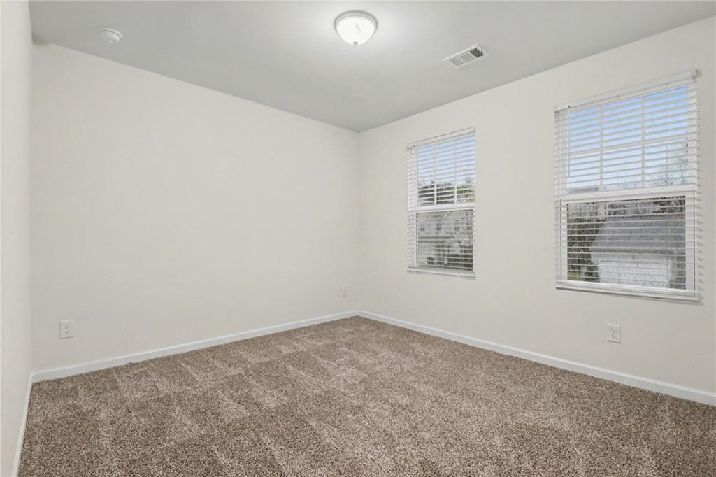 4635 Bluffton Court Cumming, GA 30028 - Photo 15 of 27 an empty room with a window