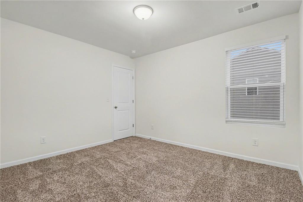4635 Bluffton Court Cumming, GA 30028 - Photo 16 of 27 an empty room with a window